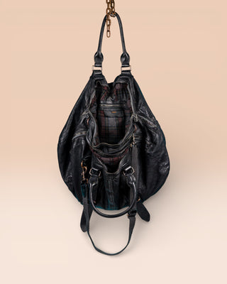 Open view of the Benheart Viaggio unisex black leather travel bag, showing plaid fabric lining and internal compartments.