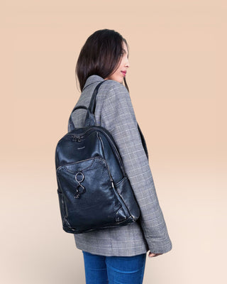 Model wearing the Benheart Zoe Special women's black beige leather backpack on the right shoulder, showing front pockets