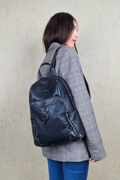 Model wearing the Benheart Zoe Special women's black beige leather backpack on the right shoulder, showing front pockets