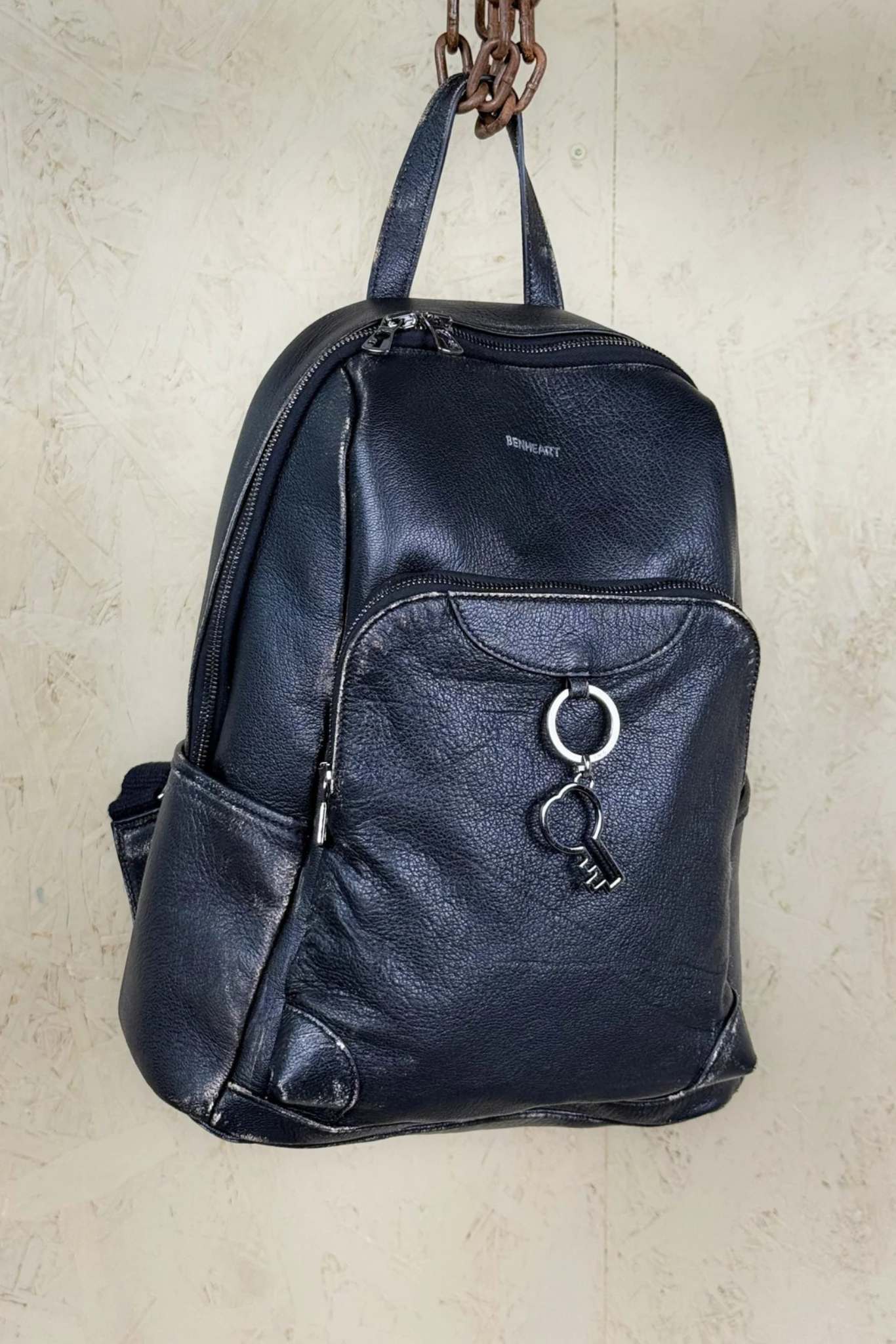 Benheart Zoe Special women’s black and beige leather backpack, front angled view with front pockets and Benheart logo