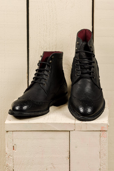 Front and top angled view of Daniel men's leather boots in black, handmade in Florence, Italy.