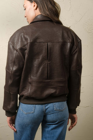 Back of the Hajar dark brown leather bomber jacket with yoke, center vent and waist band