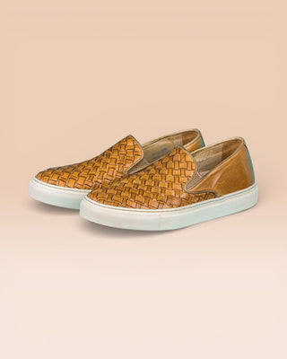 Front angled view of Iris unisex woven slip-on shoes in mahogany leather with white rubber soles.