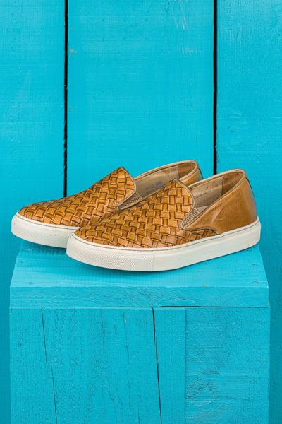 Front angled view of Iris unisex woven slip-on shoes in mahogany leather with white rubber soles.