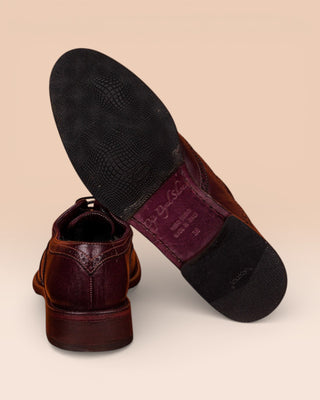 Detail of the Vibram soles on Benheart’s handmade leather shoes, DA VINCI model with swallowtail detail, dark brown color, handcrafted in Italy