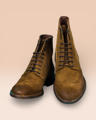 Front and top angled view of Benheart Daniel men’s lace-up brogue ankle boots with wingtip design in cognac suede.