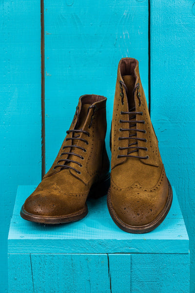 Front and top angled view of Benheart Daniel men’s lace-up brogue ankle boots with wingtip design in cognac suede.