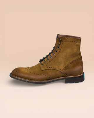Side view of Benheart Daniel men’s lace-up brogue ankle boots with wingtip design in cognac suede.