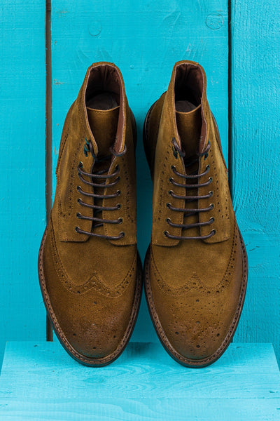 Top view of Benheart Daniel men’s lace-up brogue ankle boots with wingtip design in cognac suede.