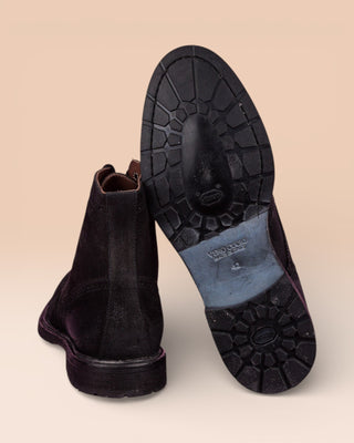 Detail of the Vibram sole of a pair of Benheart Daniel men’s smoke grey suede lace-up brogue ankle boots with wingtip design