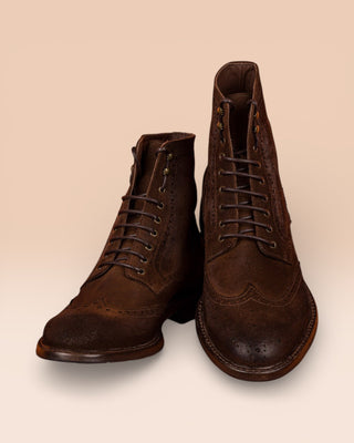 Front angled and top view of Benheart Daniel men’s lace-up brogue ankle boots with wingtips design in cigar brown suede.