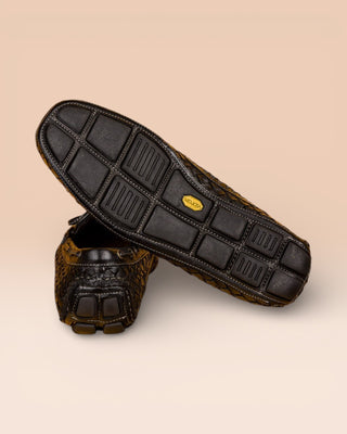 Rear view of Benheart Innocenti E951 woven black leather driving moccasins, one showing the heel and the other the Vibram rubber sole.