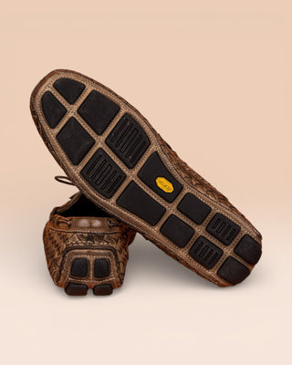 Rear view of Benheart Innocenti E951 woven taupe leather driving moccasins, one showing the heel and the other the Vibram rubber sole.