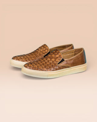 Front angled view of Iris unisex woven slip-on shoes in cerro leather with rubber soles.