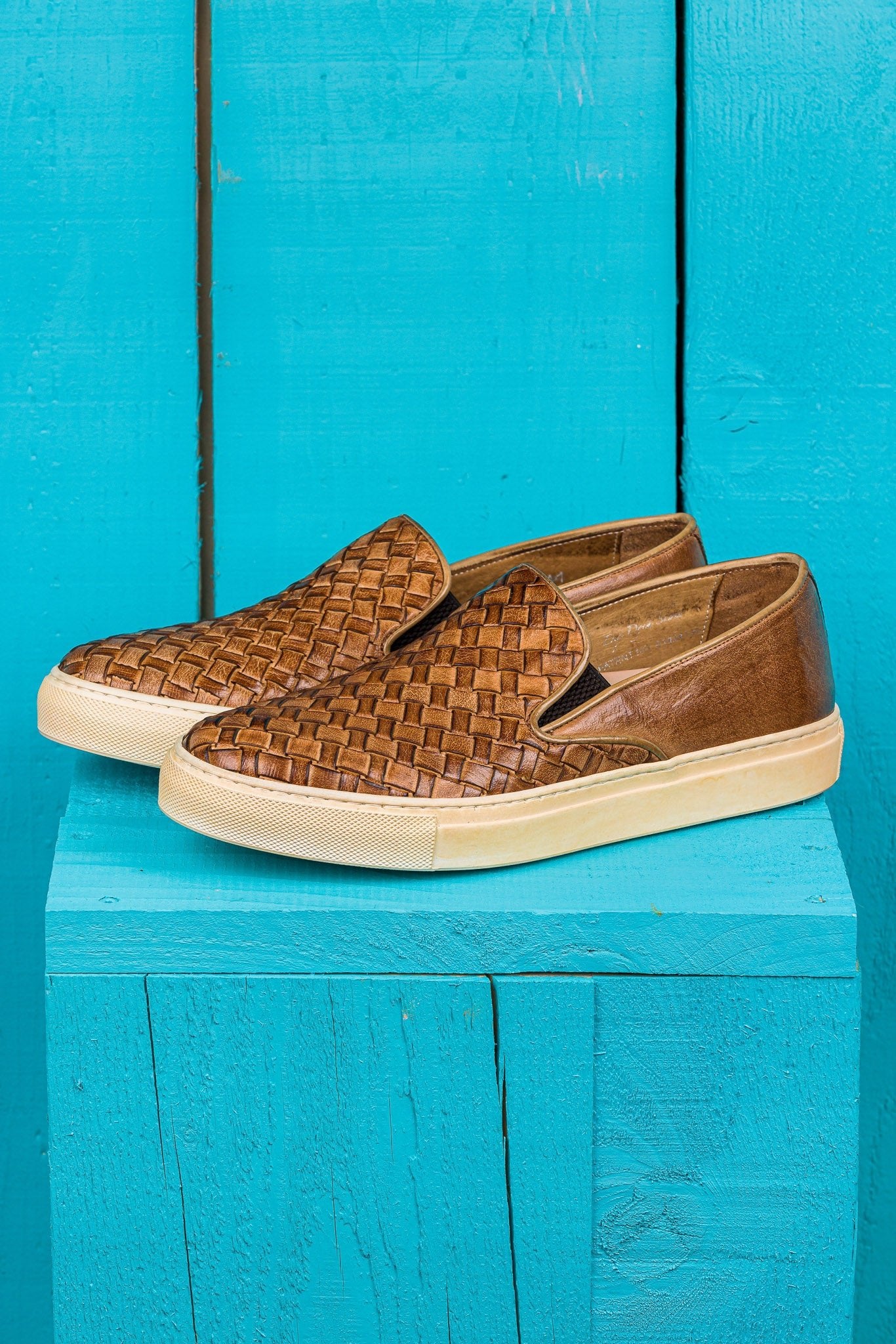 Front angled view of Iris unisex woven slip-on shoes in cerro leather with rubber soles.