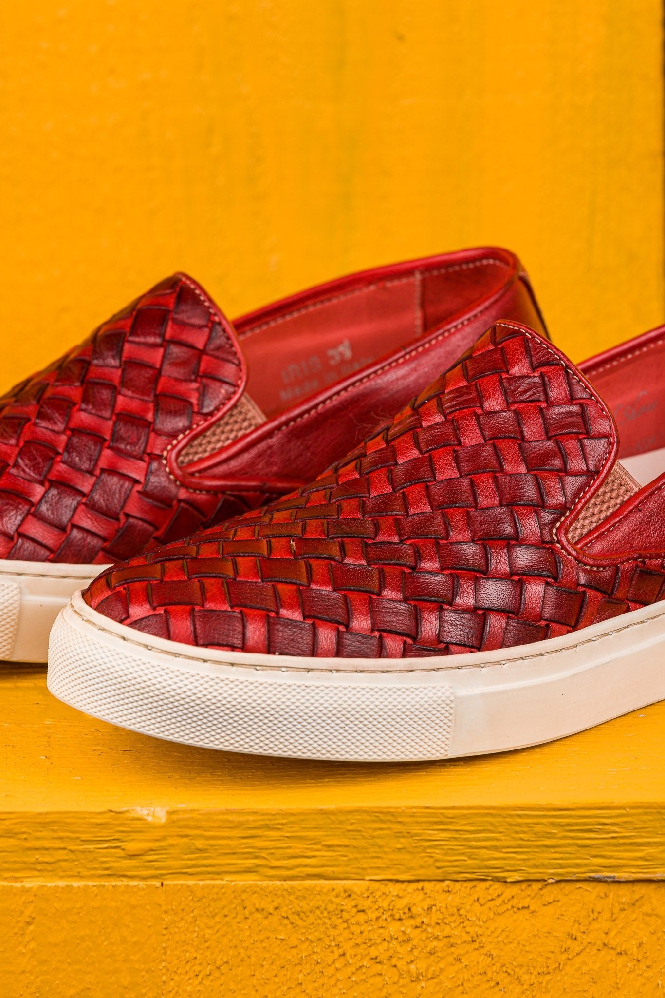 Close up view of Iris unisex woven slip-on shoes in porpora leather by Benheart.