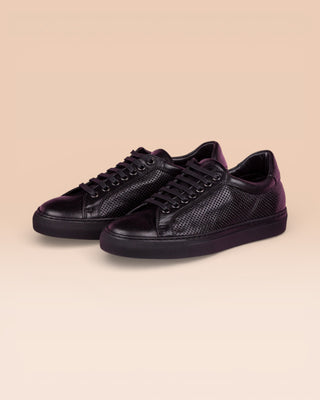 Benheart Lario unisex black perforated leather low-top sneakers, front angled view.