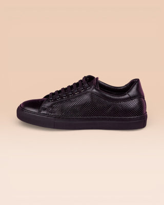 Benheart Lario unisex black perforated leather low-top sneakers, side view.