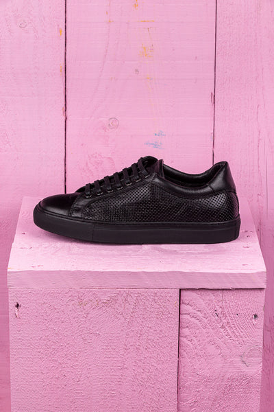 Benheart Lario unisex black perforated leather low-top sneakers, side view.