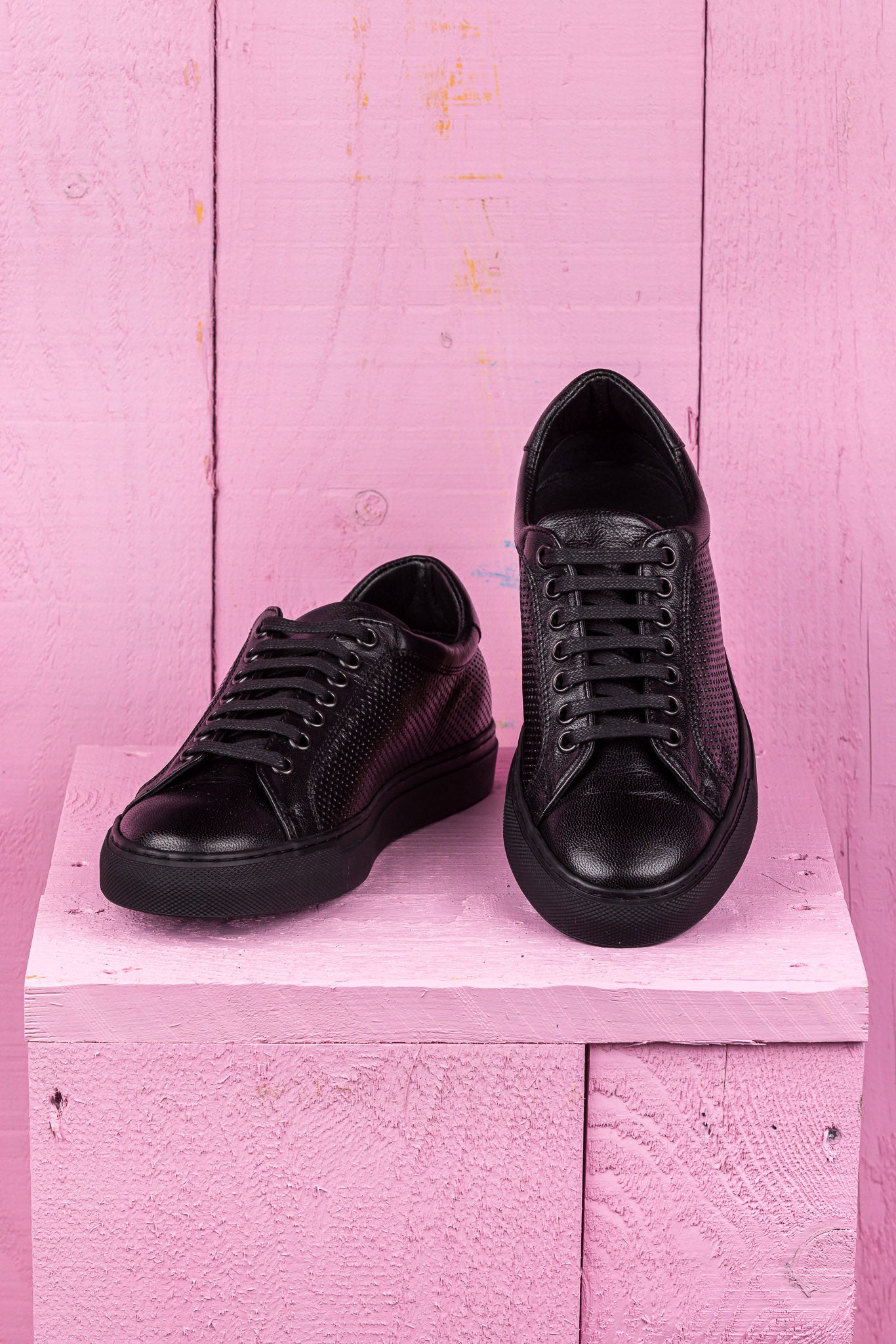 Front angled and top view of Benheart Lario unisex perforated leather sneakers shoes in black color.