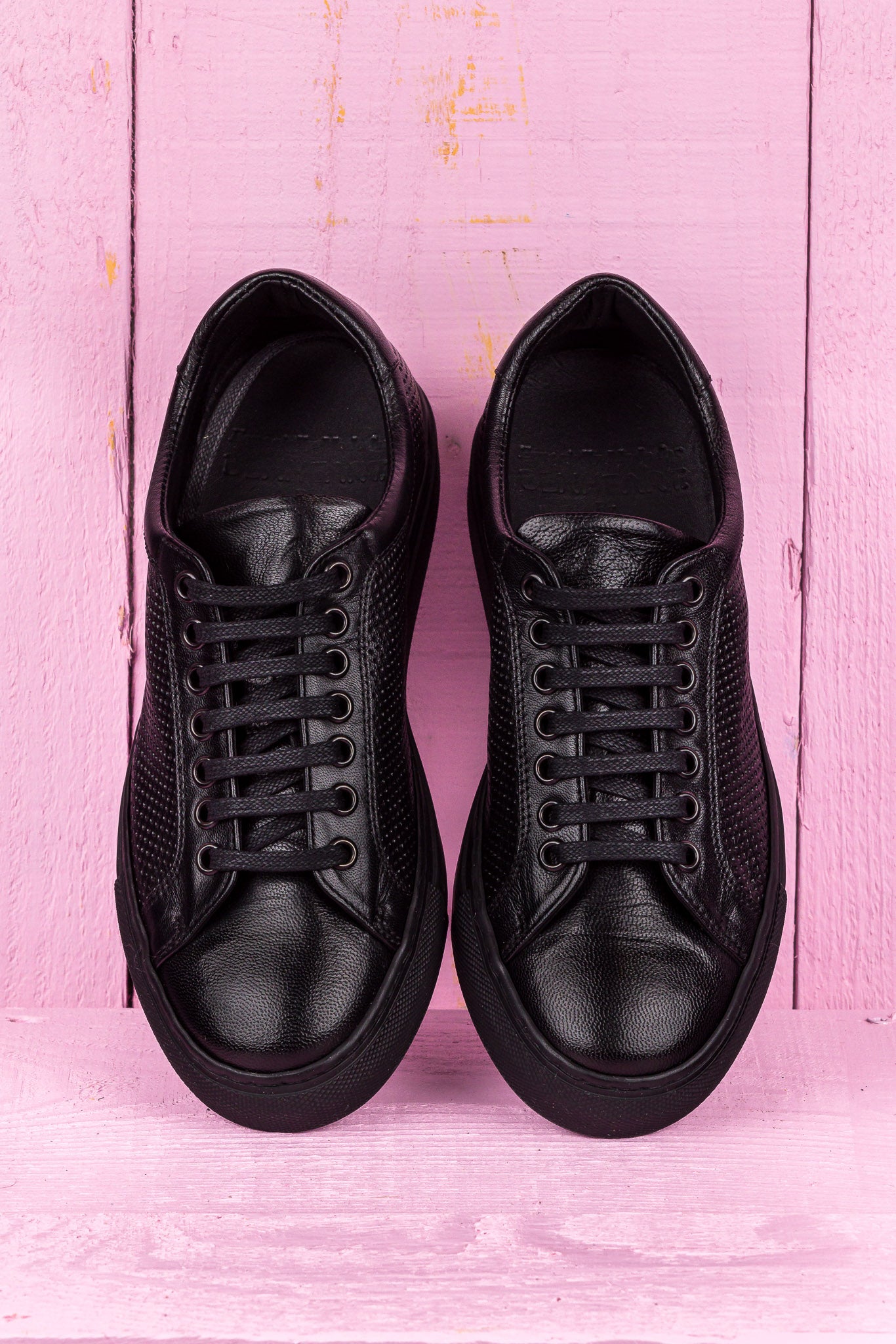 Top view of Benheart Lario unisex perforated leather sneakers shoes in black color.