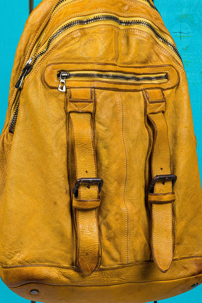 Benheart Lorenzo leather backpack in mahogany, close-up detail showing craftsmanship and texture.