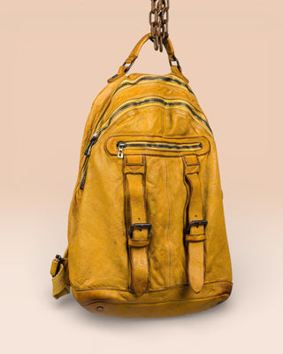 Three-quarter view of the Lorenzo unisex leather backpack in mahogany, showing front pockets and zipper details.