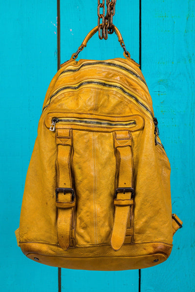 Front view of the Lorenzo unisex leather backpack in mahogany, showing front pockets and zipper details, handcrafted in Italy.