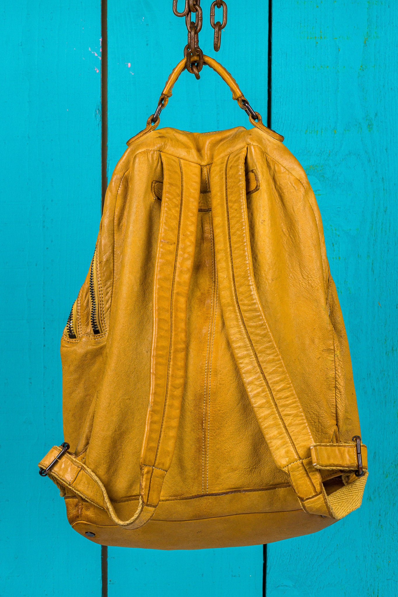 Benheart Lorenzo unisex leather backpack in mahogany, rear view showing adjustable shoulder straps.