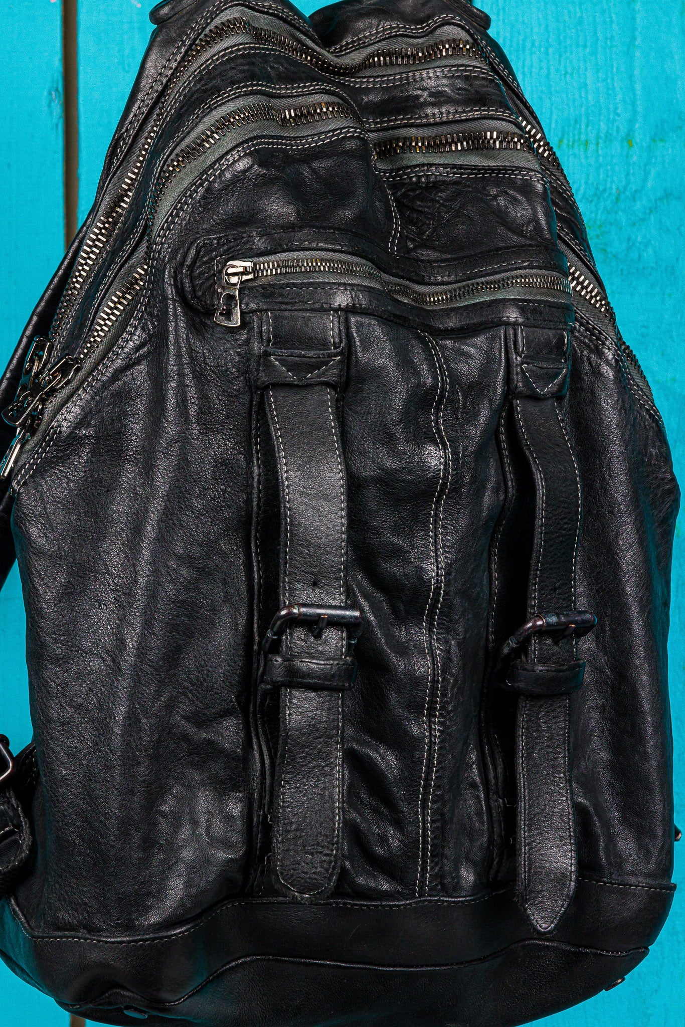 Benheart Lorenzo leather backpack in black, close-up detail showing craftsmanship and texture.