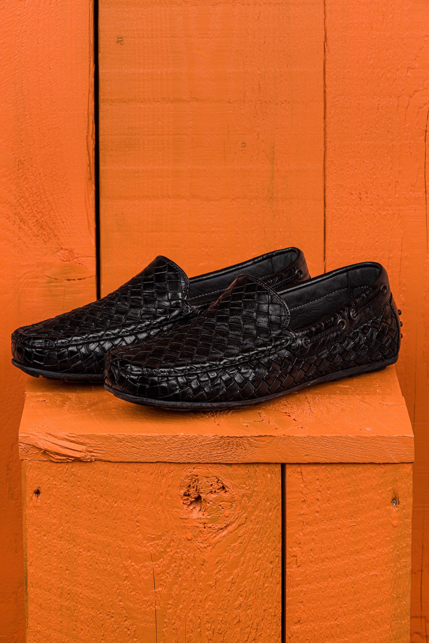 Benheart Paci A748 black woven leather driving moccasins, angled front view.