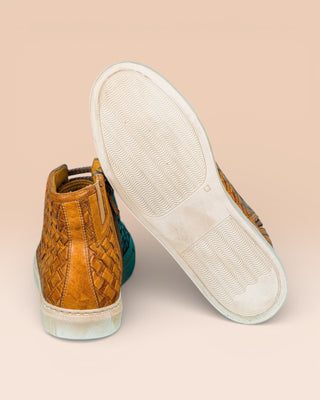 Rear view of Raimondo 8393 mahogany woven leather high-top sneakers by Benheart, close-up of white rubber soles.