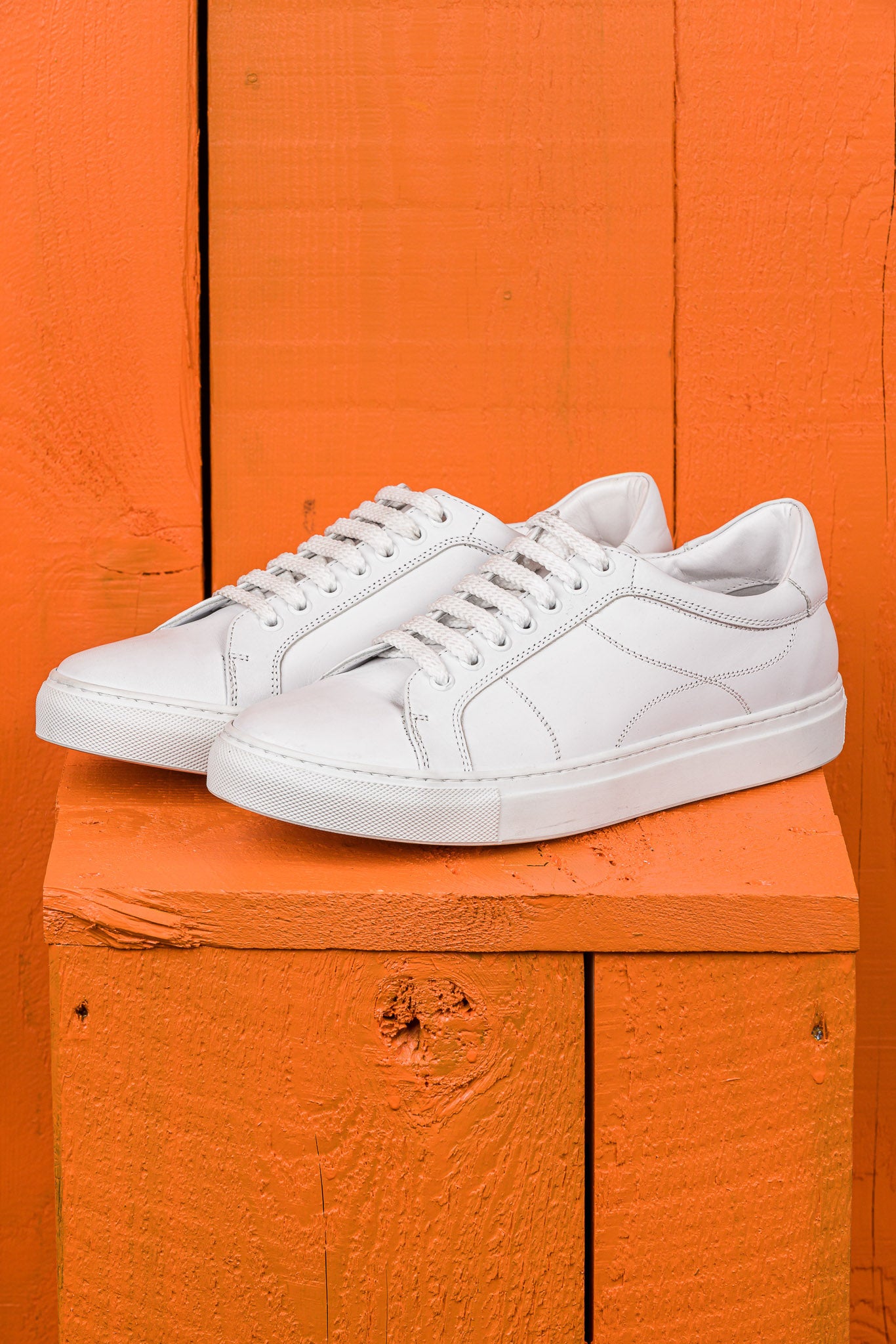 Venus unisex white leather sneakers by Benheart, front angled view.