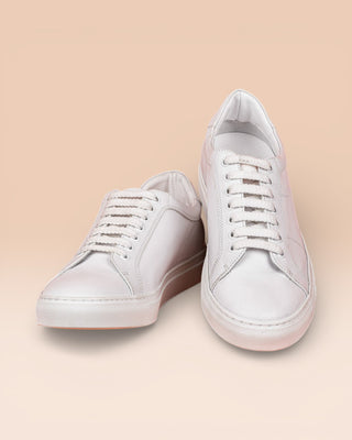 Front angled and top view of Venus unisex white leather sneakers, rubber soles.